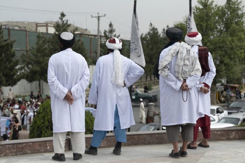 Taliban group members investigate and pursue youths by checking mobile phones in Kandahar province