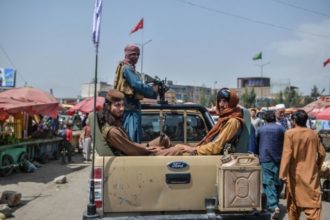 The Taliban dismissed a young man from their ranks for taking a memorial photo with a former government official